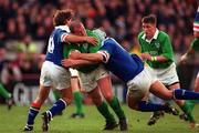 4 March 2000; Peter Clohessy of Ireland is tackled by Diego Dominguez, left, and Mauro Bergamasco of Italy during the Lloyds TSB 6 Nations match between Ireland and Italy at Lansdowne Road in Dublin. Photo by Brendan Moran/Sportsfile