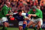 4 March 2000; Luca Martin of Italy is tackled by Keith Wood, left, and Malcolm O'Kelly of Ireland during the Lloyds TSB 6 Nations match between Ireland and Italy at Lansdowne Road in Dublin. Photo by Brendan Moran/Sportsfile