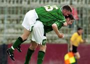 22 November 1999; Graham Barrett of Republic of Ireland, bottom, cebebrates with teamate Brendan McGill after scoring the first of his two goals during the UEFA Under 18 Championship Preliminary Round match between Republic of Ireland and Liechenstein at the National Stadium in Ta' Qali, Malta. Photo by David Maher/Sportsfile