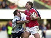 11 December 1999; Jason Holland of Munster holds off Jerome Sieurac of Colomiers during the Heineken Cup Pool 4 Round 3 match between Colomiers and Munster at Stade Toulousien in Toulouse, France. Photo by Brendan Moran/Sportsfile
