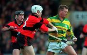 31 October 1999; Jim Cashman of Blackrock in action against Eddie Enright, left, and Dave Bennett of UCC during the Cork County Senior Club Hurling Championship Final match between Blackrock and UCC at Páirc Uí Chaoimh in Cork. Photo by Brendan Moran/Sportsfile