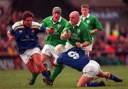 4 March 2000; Keith Wood of Ireland is tackled by Alessandro Troncon of Italy during the Lloyds TSB 6 Nations match between Ireland and Italy at Lansdowne Road in Dublin. Photo by Damien Eagers/Sportsfile