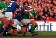 4 March 2000; John Hayes of Ireland is tackled by Vilhelmus Visser of Italy during the Lloyds TSB 6 Nations match between Ireland and Italy at Lansdowne Road in Dublin. Photo by Matt Browne/Sportsfile