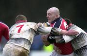 15 January 2000; Keith Wood of Munster is tackled by Richard Field, left, and Geraint Lewis of Pontypridd during the Heineken Cup Pool 4 Round 6 match between Pontypridd and Munster at Sardis Road in Pontypridd, Wales. Photo by Matt Browne/Sportsfile