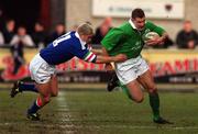 3 March 2000; Matt Mostyn of Ireland  is tackled by Ezio Galon of Italy during the Six Nations A Rugby Championship match between Ireland and Italy at Donnybrook Stadium in Dublin. Photo by Aoife Rice/Sportsfile