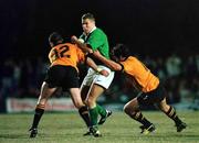 31 May 1999; Matt Mostyn of Ireland is tackled by Craig Wells, 12, and James Lancaster of New South Wales Country XV during the match between Ireland at New South Wales Country XV on Ireland's tour of Australia at the Woy Woy Oval in New South Wales, Australia. Photo by Matt Browne/Sportsfile