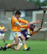 24 July 1999; Michael McClements of Antrim in action against Diarmuid Lyng of Wexford during the All-Ireland Minor Hurling Championship Quarter-Final match between Antrim and Wexford at Parnell Park in Dublin. Photo by Ray Lohan/Sportsfile