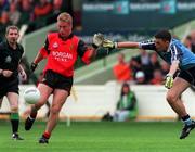29 August 1999; Michael Walsh of Down shoots for a point against Paul Casey of Dublin during the All-Ireland Minor Football Championship Semi-Final match between Dublin and Down at Croke Park in Dublin. Photo by Brendan Moran/Sportsfile