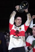 12 December 1999; UCC captain Michéal O Cróinín lifts the cup after the AIB Munster Senior Club Football Championship Final match between UCC and Doonbeg at the Gaelic Grounds in Limerick. Photo by Brendan Moran/Sportsfile