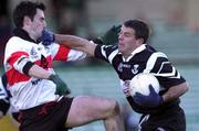 12 December 1999; Padraig Gallagher of Doonbeg holds off the challenge of Ian Twiss of UCC during the AIB Munster Senior Club Football Championship Final match between UCC and Doonbeg at the Gaelic Grounds in Limerick. Photo by Brendan Moran/Sportsfile