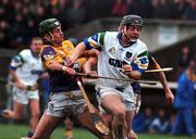 27 February 2000; Paul Flynn of Waterford is tackled by Declan Rush of Wexford during the Church & General National Hurling League Division 1B Round 2 match between Waterford and Wexford at Walsh Park in Waterford. Photo by Matt Browne/Sportsfile