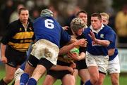 26 February 2000; Paul O'Connell of Young Munster is tackled by Trevor Brennan, 6, and Fergal Campion of St Mary's during the AIB League Division 1 match between St Mary's and Young Munster at Templeville Road in Dublin. Photo by Matt Browne/Sportsfile