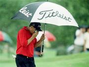2 August 1999; Peter O'Malley shelters from the rain during day four of the Smurfit European Open at the K-Club in Straffan, Kildare. Photo by Matt Browne/Sportsfile