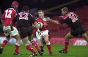 28 November 1999; Peter Stringer of Munster in action against theirry Lacroix and Kevin Sorrell, 12, of Saracens during the Heineken Cup Pool 4 match at Vicarage Road in Watford, London. Photo by Brendan Moran/Sportsfile