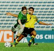 10 April 1999; Richie Baker of Republic of Ireland in action against Simon Colosimo of Australia during the 1999 FIFA World Youth Championship Group C Round 3 match between Australia and Republic of Ireland at the Liberty Stadium in Ibadan, Nigeria. Photo by David Maher/Sportsfile
