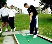 22 July 1999; Richie Partridge tests his putting skills on a local crazy golf course, watched by team-mates Clive Delaney and Colin Healy after a Republic of Ireland training session at Karlbergsplan in Linkoping, Sweden. Photo by David Maher/Sportsfile