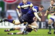 15 January 2000; Robert Casey of Leinster is tackled by Andy Goode of Leicester during the Heineken Cup Pool 1 Round 6 match between Leicester and Leinster at Welford Road in Leicester, England. Photo by Brendan Moran/Sportsfile