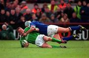 4 March 2000; Ronan O'Gara of Ireland is tackled by Mauro Bergamasco of Italy during the Lloyds TSB 6 Nations match between Ireland and Italy at Lansdowne Road in Dublin. Photo by Brendan Moran/Sportsfile