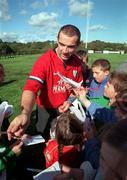 5 October 1999; Conor O'Shea signs autographs after Ireland Rugby squad training at Clonakilty RFC in Cork. Photo by Matt Browne/Sportsfile