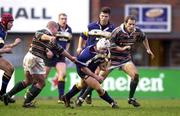 15 January 2000; Shane Byrne of Leinster is tackled by Richard Cockerill of Leicester during the Heineken Cup Pool 1 Round 6 match between Leicester and Leinster at Welford Road in Leicester, England. Photo by Brendan Moran/Sportsfile