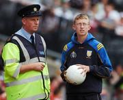 4 August 2007; Dublin manager Paul Caffrey, on duty as a Garda, in conversation with his son Adam. Bank of Ireland Football Championship Quarter Final, Tyrone v Meath, Croke Park, Dublin. Picture Credit; Ray McManus / SPORTSFILE