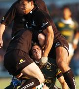 21 August 2007; Ruan Pienaar, South Africa, is tackled by Conor Mcphillips, left, and Ofisa Treviranus, Connacht. Rugby World Cup Warm Up Game, Connacht v South Africa, Sportsground, Galway. Photo by Sportsfile *** Local Caption ***