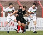 25 August 2007; Glentoran's Phillip Carson and Paul Leeman in action against Larne's Marty Hunter. CIS Insurance Cup, Group B, Glentoran v Larne, The Oval, Belfast, Co. Antrim. Picture credit: Oliver McVeigh / SPORTSFILE