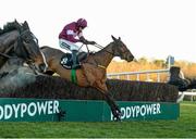 28 December 2014; Road To Riches with Bryan Cooper up, jumps the last on their way to winning the Lexus Steeplechase. Leopardstown Christmas Festival, Leopardstown, Co. Dublin. Photo by Sportsfile