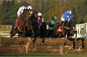 28 December 2014; Eventual winner Shemshal, with Ruby Walsh up, extreme left, clears the last on their way to winning the Irish Daily Star Christmas Novice Handicap Hurdle ahead of second placed Mr Diablo, with Luke Denpsey up, extreme right. Leopardstown Christmas Festival, Leopardstown, Co. Dublin. Picture credit: Pat Murphy / SPORTSFILE
