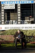 29 December 2014; Sean McConnell from Castleblaney, Co. Monaghan looks up his racecard before the days races. Leopardstown Christmas Festival, Leopardstown, Co. Dublin. Picture credit: Barry Cregg / SPORTSFILE