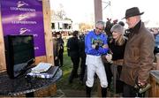 29 December 2014; Jockey Ruby walsh and trainer of Hurricane Fly Willie Mullins watch a replay of the Ryanair Hurdle. Leopardstown Christmas Festival, Leopardstown, Co. Dublin. Photo by Sportsfile