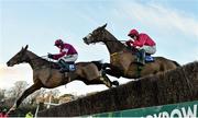 29 December 2014; Don Poli, left, with Bryan Cooper up,  jumps the last ahead of Apache Stronghold, with Paul Carberry up, on their way to winning the Topaz Novice Steeplechase. Leopardstown Christmas Festival, Leopardstown, Co. Dublin. Picture credit: Barry Cregg / SPORTSFILE