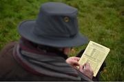 30 December 2014; A spectator markes his card during the Abbeyfeale Coursing Meeting in Co. Limerick. Picture credit: Stephen McCarthy / SPORTSFILE