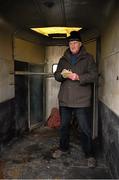 30 December 2014; Brendan O'Sullivan, from Abbeyfeale, Co. Limerick, watches on from the back of a horse box during the Abbeyfeale Coursing Meeting in Co. Limerick. Picture credit: Stephen McCarthy / SPORTSFILE