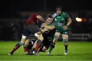 1 January 2015; Tom McCartney, Connacht, is tackled by Tommy O'Donnell, left, and BJ Botha, Munster. Connacht v Munster, Guinness PRO12, Round 12. Sportsground, Galway. Picture credit: Diarmuid Greene / SPORTSFILE