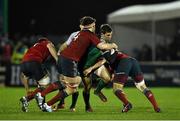 1 January 2015; Craig Ronaldson, Connacht, is tackled by Billy Holland, left, and BJ Botha, Munster. Connacht v Munster, Guinness PRO12 Round 12. Sportsground, Galway. Picture credit: Ramsey Cardy / SPORTSFILE