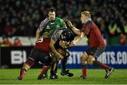 1 January 2015; John Muldoon, Connacht, is tackled by BJ Botha, left, and John Ryan, Munster. Connacht v Munster, Guinness PRO12 Round 12. Sportsground, Galway. Picture credit: Ramsey Cardy / SPORTSFILE