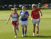 22 August 2007; Juliete Murphy, right, Cork, Mary Kirwan, Laois, and Anne Dooher, left, Tyrone, representing three of the remaining teams in the Senior and Intermediate Championships which will be broadcast on TG4. The semi-finals for both competitions are on consecutive weekend's starting Saturday 25th August 2007. TG4 will broadcast a live doubleheader from Portlaoise this Saturday starting at 5.15pm and a second doubleheader from Breffni Park the following Saturday. Dublin University Cricket Grounds, Trinity College, Dublin. Picture credit: Ray Lohan / SPORTSFILE