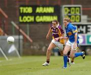 25 August 2007; Tara Moloney, Wexford, in action against Jennifer Grant, Tipperary. TG4 All-Ireland Intermediate Ladies Football Championship Semi-Final, Tipperary v Wexford, O'Moore Park, Portlaoise. Photo by Sportsfile  *** Local Caption ***