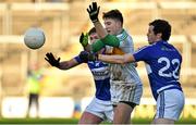 4 January 2015; Joseph O'Connor, Offaly, in action against Padraig McEvoy, left, and Padraig McMahon, Laois. Bord na Mona O'Byrne Cup, Group A, Round 1, Offaly v Laois. O'Connor Park, Tullamore, Co. Offaly. Picture credit: Barry Cregg / SPORTSFILE