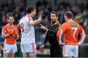 4 January 2015; Colm Cavanagh, Tyrone,protests his innocence to Referee Noel Mooney after receiving a red card along with Ciaran McKeever, Armagh. Bank of Ireland Dr McKenna Cup, Group C, Round 1, Armagh v Tyrone. Athletic Grounds, Armagh. Picture credit: Oliver McVeigh / SPORTSFILE