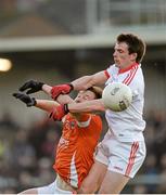 4 January 2015; Aidan McCrory, Tyrone, in action against  Stefan Forker, Armagh. Bank of Ireland Dr McKenna Cup, Group C, Round 1, Armagh v Tyrone. Athletic Grounds, Armagh. Picture credit: Oliver McVeigh / SPORTSFILE