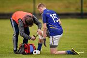 4 January 2015; Physiotherapy Ian Kenny, attends to Wicklow's Tommy Kelly at half time. Bord na Mona O'Byrne Cup, Group D, Round 1, Wicklow v Carlow IT. Blessington, Co. Wicklow. Picture credit: Ray McManus / SPORTSFILE