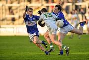 4 January 2015; Bernard Allen, Offaly, in action against Brian King, left, and Padraig McMahon, Laois. Bord na Mona O'Byrne Cup, Group A, Round 1, Offaly v Laois. O'Connor Park, Tullamore, Co. Offaly. Picture credit: Barry Cregg / SPORTSFILE