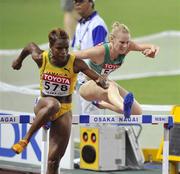 28 August 2007; Ireland's Derval O'Rourke clears a hurdle behind Vonette Dixon of Jamaica, 578, in her semi-final of the Women's 100m Hurdles where she finished 8th in a time of 12.98. The 11th IAAF World Championships in Athletics, Nagai Stadium, Osaka, Japan. Picture credit: Brendan Moran / SPORTSFILE  *** Local Caption ***