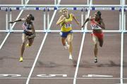 29 August 2007; Michelle Perry, left, of the USA, comes home to win the Women's 100m Hurdles Final from second placed Perdita Felicien of Canada, right, and fourth placed Susanna Kallur, Sweden. The 11th IAAF World Championships in Athletics, Nagai Stadium, Osaka, Japan. Picture credit: Brendan Moran / SPORTSFILE  *** Local Caption ***