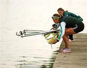 30 August 2007; Sinead Jennings, left, and Niamh NiCheilleachair, Lightweight Womens Two's, lower their boat into the water for practice during the 2007 World Rowing Championships. Oberschleissheim, Munich, Germany. Picture credit: David Maher / SPORTSFILE