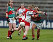 1 September 2007; Cathy Donnelly, Tyrone, scores the opening goal of the game against Mayo despite the tackle of Nuala O'Shea. TG4 All-Ireland Senior Ladies Football Championship Semi-Final, Mayo v Tyrone, Kingspan Breffni Park, Cavan. Picture credit: Matt Browne / SPORTSFILE