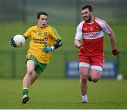 4 January 2015; Eoin McHugh, Donegal, in action against Mark Lynch, Derry. Bank of Ireland Dr McKenna Cup, Group B, Round 1, Derry v Donegal. Owenbeg Centre of Excellence, Dungiven, Co. Derry. Picture credit: Stephen McCarthy / SPORTSFILE