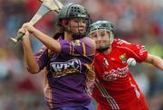 9 September 2007; Una Leacy, Wexford, in action against Amanda O'Regan, Cork, on the way to scoring her side's second goal. Gala All-Ireland Senior Camogie Final, Cork v Wexford, Croke Park, Dublin. Picture credit; Brian Lawless / SPORTSFILE